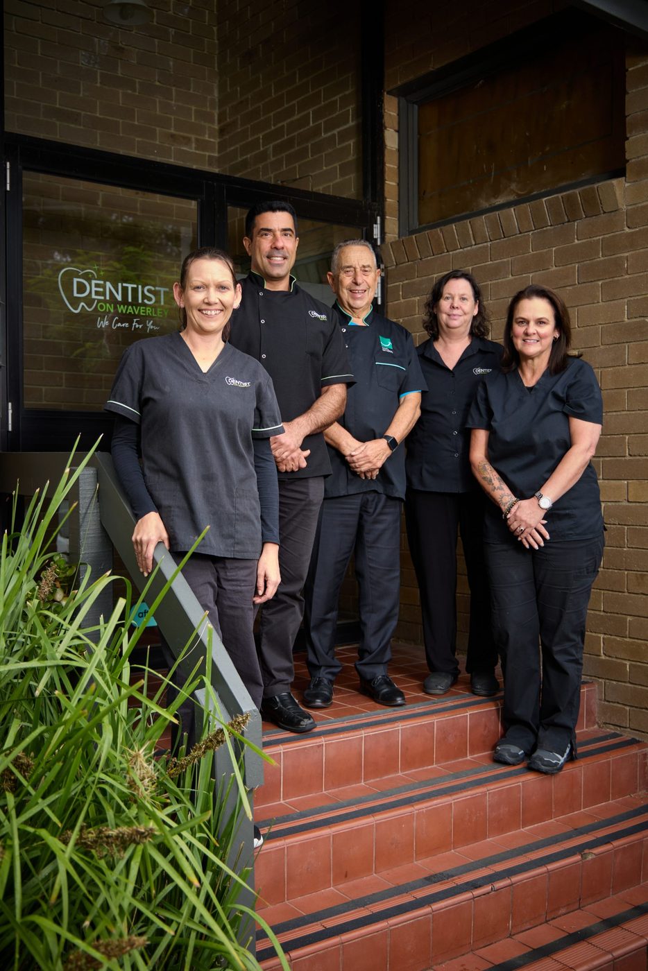 The Dentist on Waverley team at the front entrance of the practice